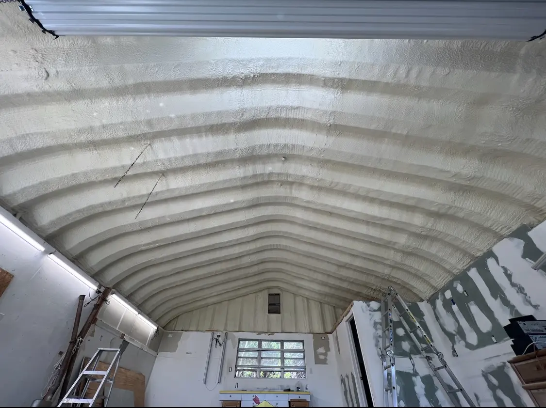 Spray polyurethane foam applied to the underside of a metal roof deck in Cooper City